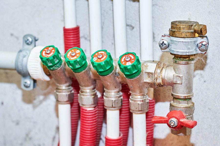 Pipes and valves for hot and cold water in heating and water supply system